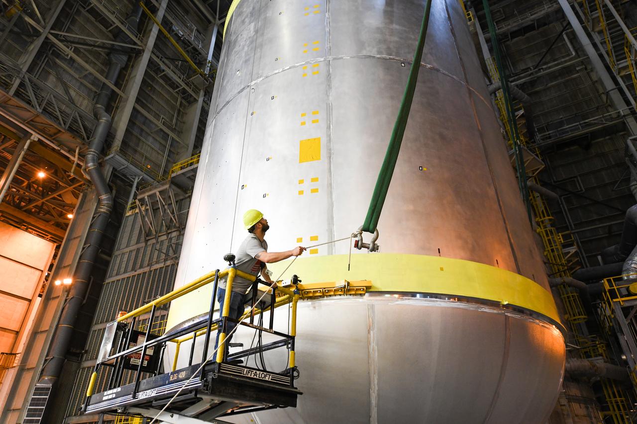 This image shows the latest progress NASA has made in manufacturing the liquid oxygen tank for the second core stage of NASA’s Space Launch System (SLS) rocket. The liquid oxygen tank will be used for the first crewed mission, Artemis II, of the agency’s Artemis program. Teams at NASA’s Michoud Assembly Facility in New Orleans recently completed internal cleaning of the liquid oxygen, or LOX, tank at the facility. Following the cleaning, crews prepared the propellant tank for the next phase of phase of assembly in a different area of the factory by moving, or breaking over, the tank from a vertical to horizontal position. The LOX tank is one of five major elements that make up the rocket’s massive 212-foot-tall core stage. The propellant tank holds 196,000 gallons of supercooled liquid oxygen to help fuel four RS-25 engines, and the internal cleaning ensures no contaminants make their way into the complex propulsion and engine systems of the deep space rocket. The stage, which includes a cluster of four RS-25, will produce more than 2 million pounds of thrust to help launch the SLS rocket and astronauts aboard NASA’s Orion spacecraft around the Moon for Artemis II.   NASA is working to land the first woman and the next man on the Moon by 2024. The agency’s SLS rocket offers more payload mass, volume capability and energy to speed missions through deep space and enable NASA’s Artemis lunar program. SLS, along with Orion, the human landing system, and the Gateway in orbit around the Moon are NASA’s backbone for deep space exploration. No other rocket is capable of carrying astronauts in Orion around the Moon in a single mission.
